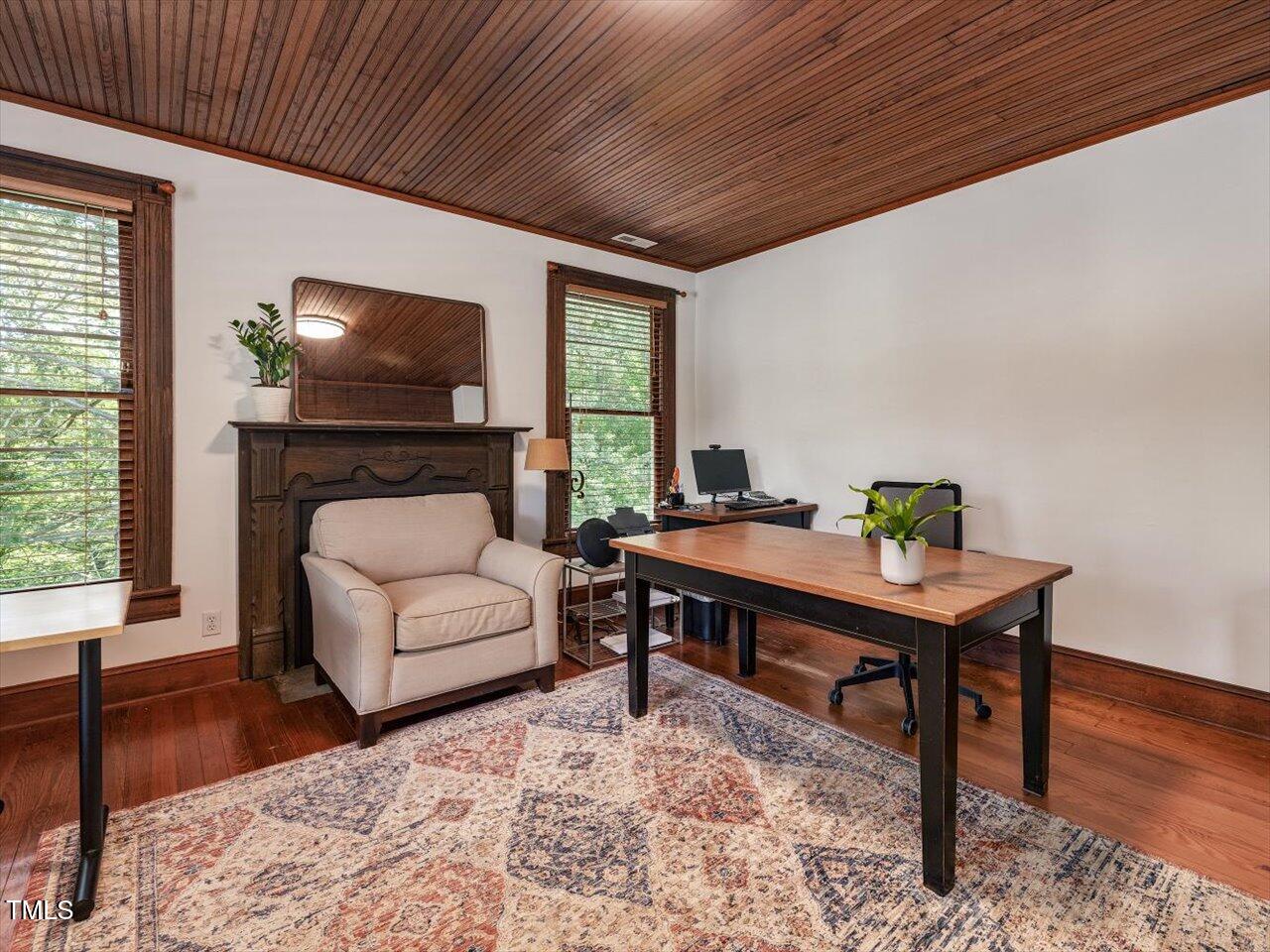 967 Bynum Road Pittsboro, NC 27312 - Photo 66 of 100 a living room with furniture a flat screen tv and a fireplace