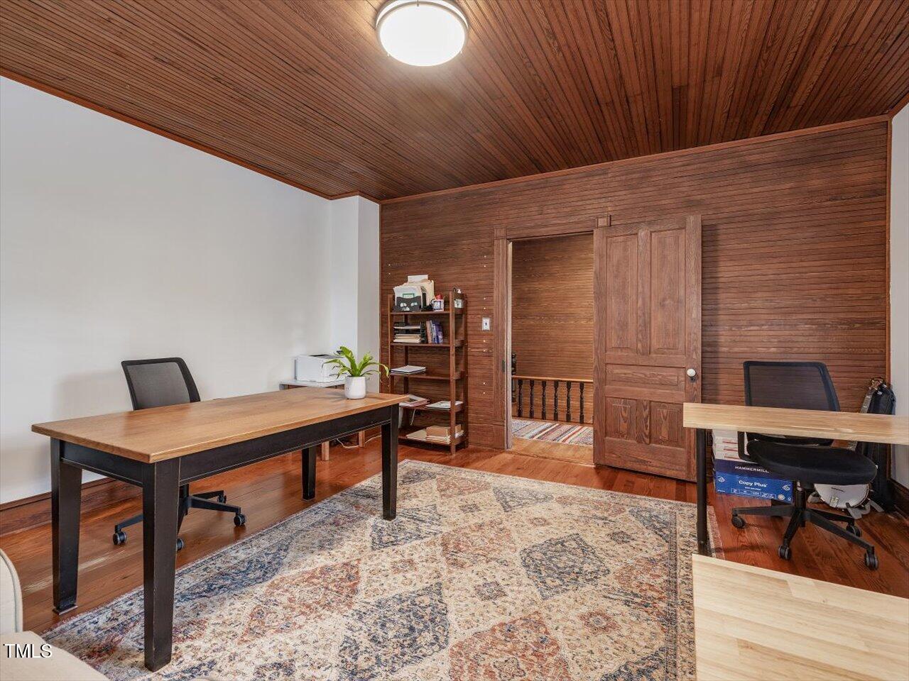 967 Bynum Road Pittsboro, NC 27312 - Photo 67 of 100 a living room with furniture a piano and a bookshelf