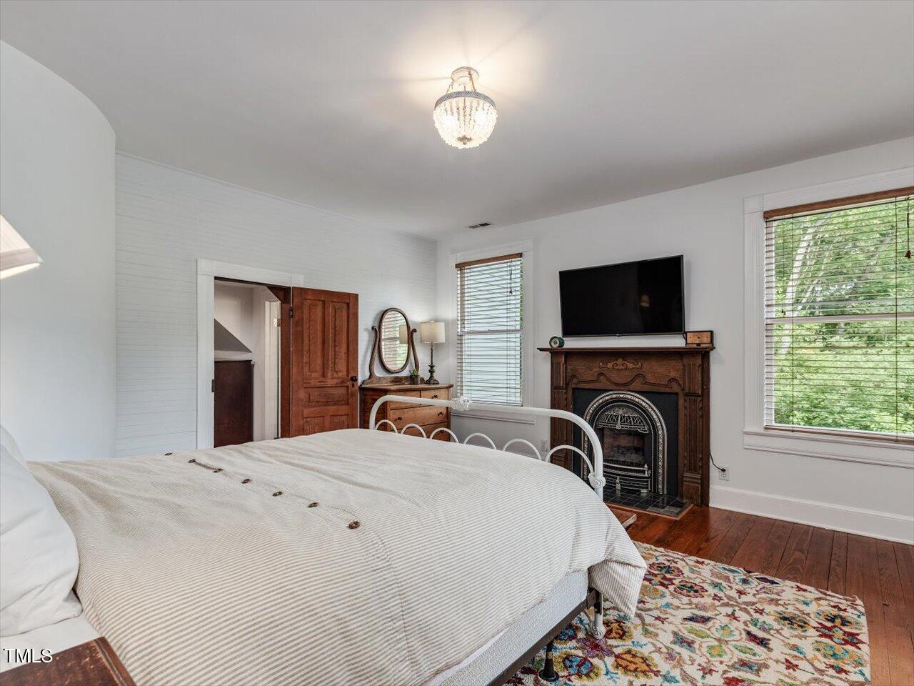 967 Bynum Road Pittsboro, NC 27312 - Photo 68 of 100 a bedroom with a bed and a television