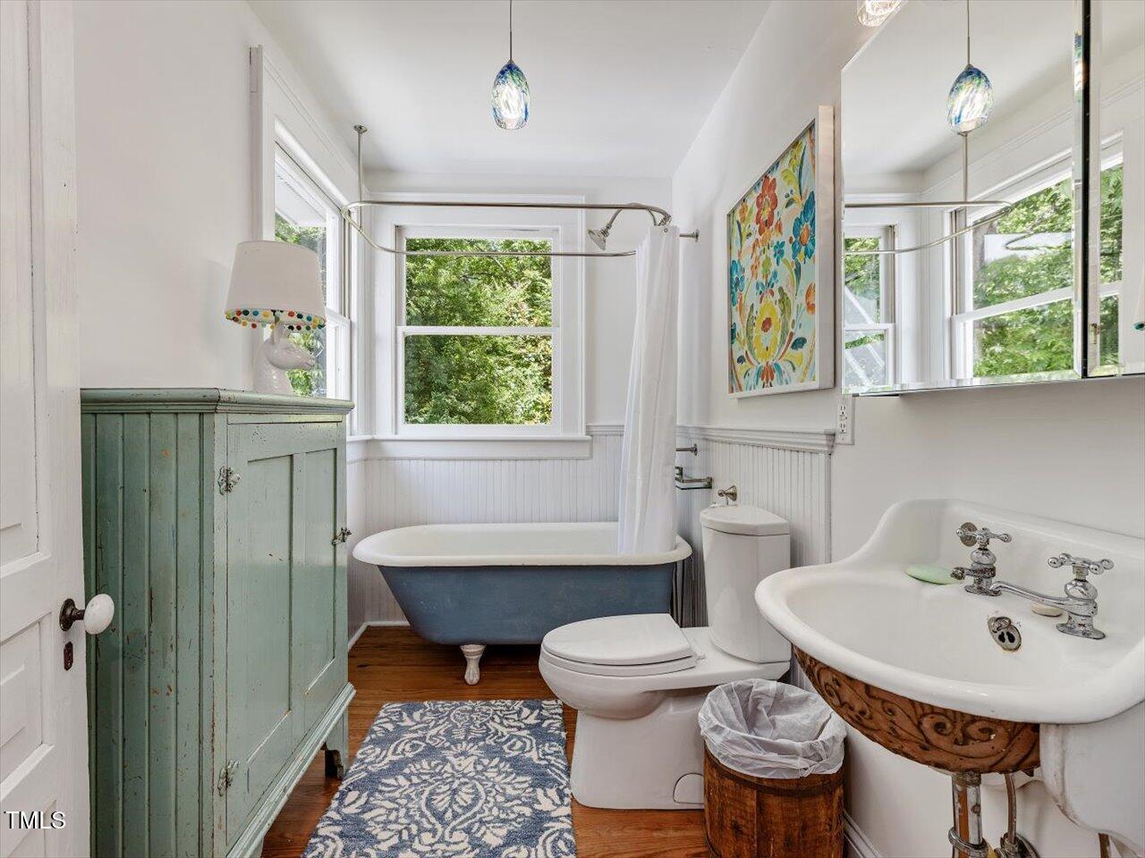 967 Bynum Road Pittsboro, NC 27312 - Photo 73 of 100 a bathroom with a sink a toilet and a mirror