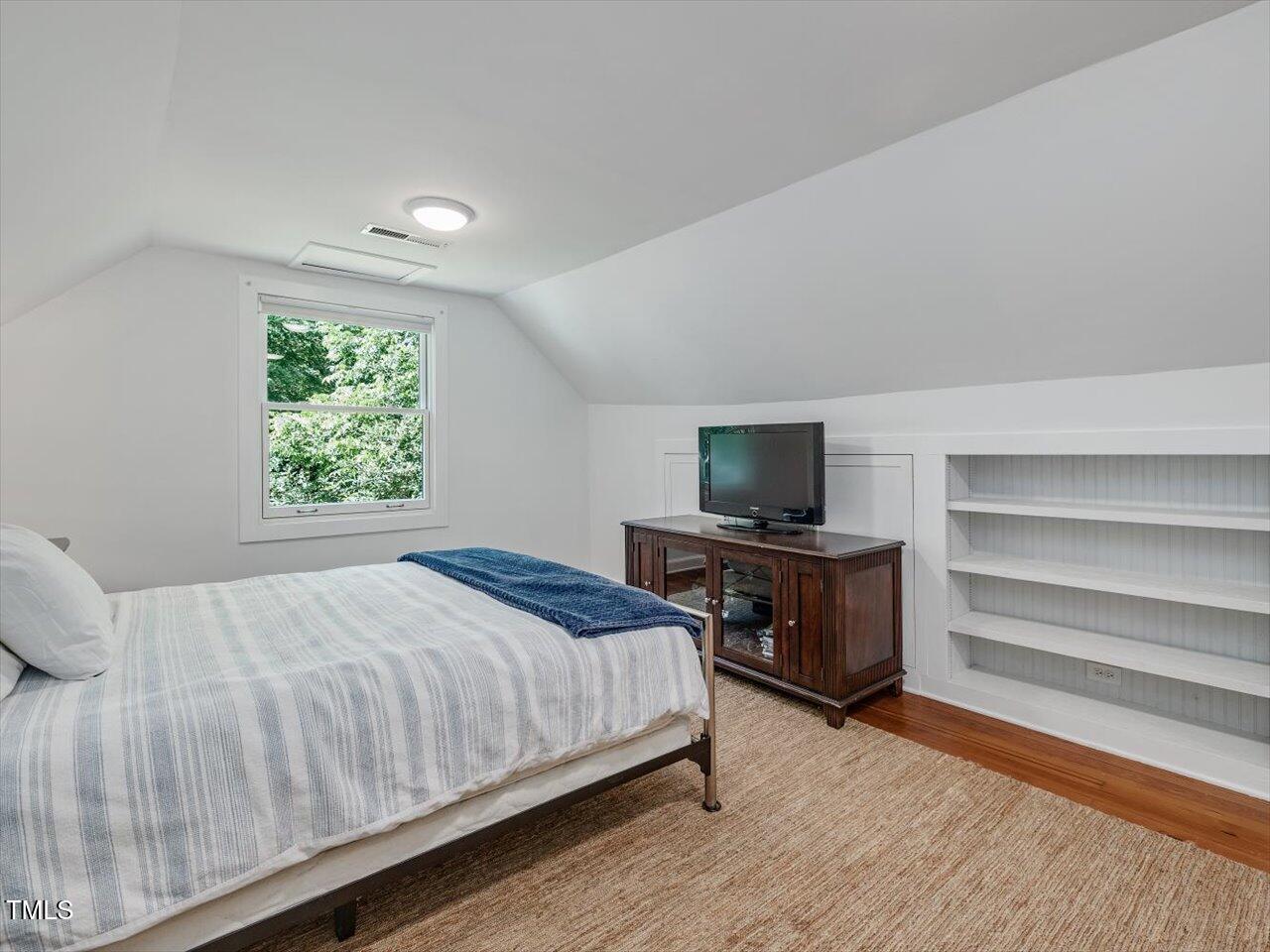 967 Bynum Road Pittsboro, NC 27312 - Photo 81 of 100 a bedroom with a bed and a television