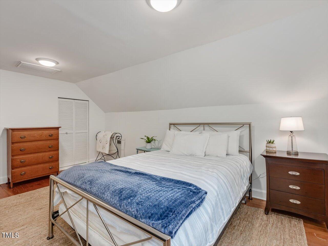 967 Bynum Road Pittsboro, NC 27312 - Photo 82 of 100 a bedroom with a bed and a dresser