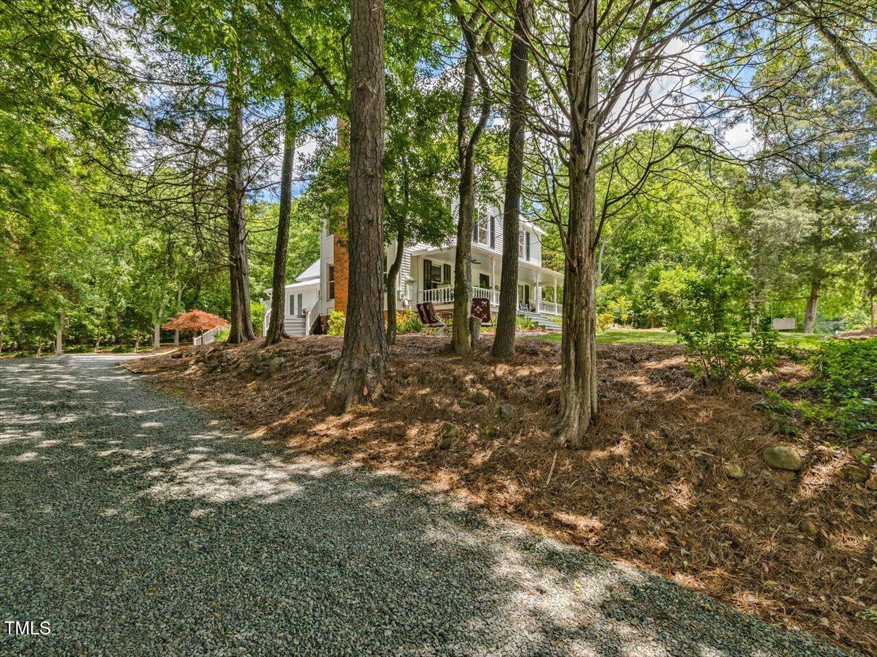 967 Bynum Road Pittsboro, NC 27312 - Photo 97 of 100 a backyard of a house with lots of green space