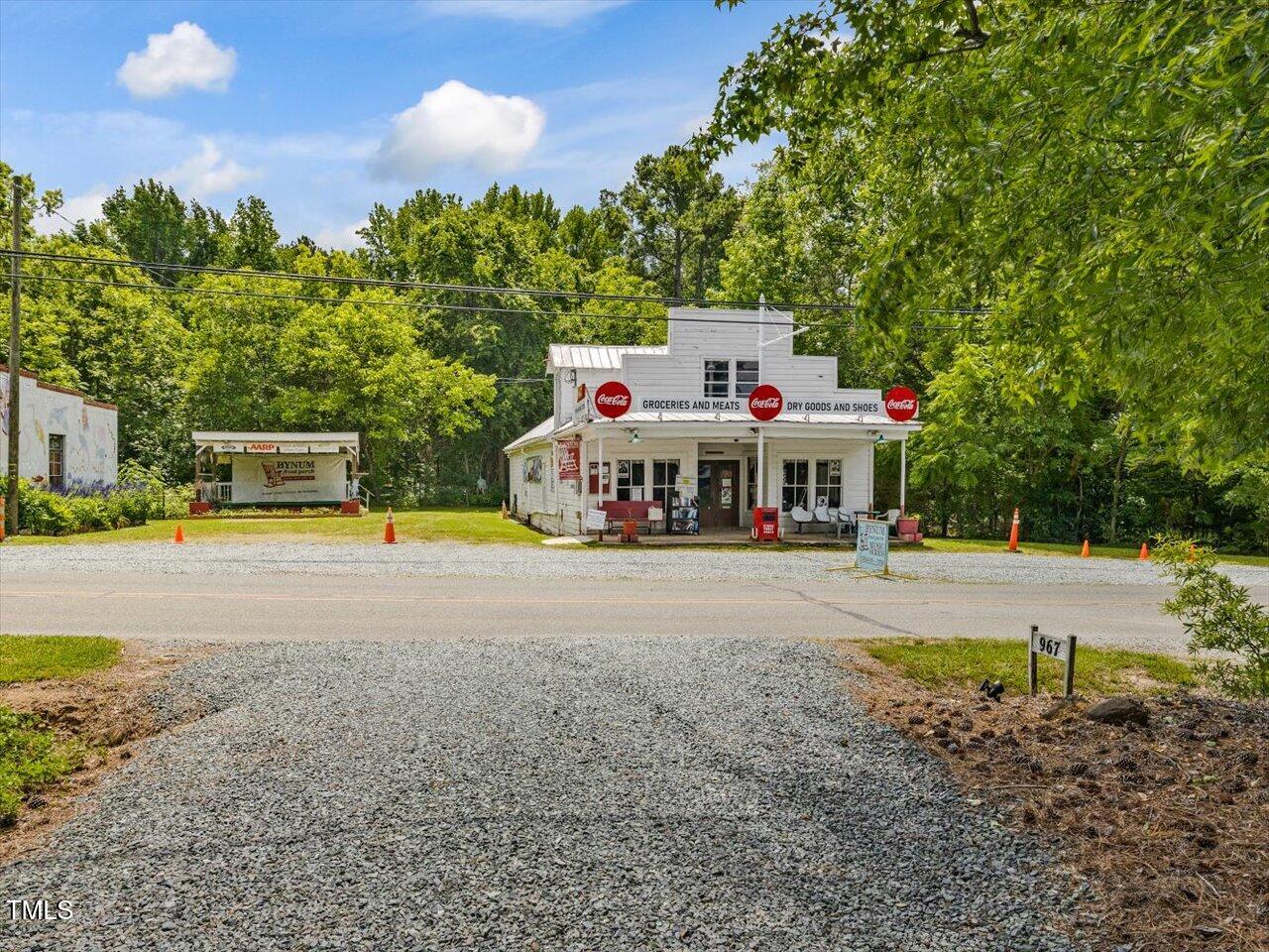 967 Bynum Road Pittsboro, NC 27312 - Photo 98 of 100 a view of a house with backyard and sitting area