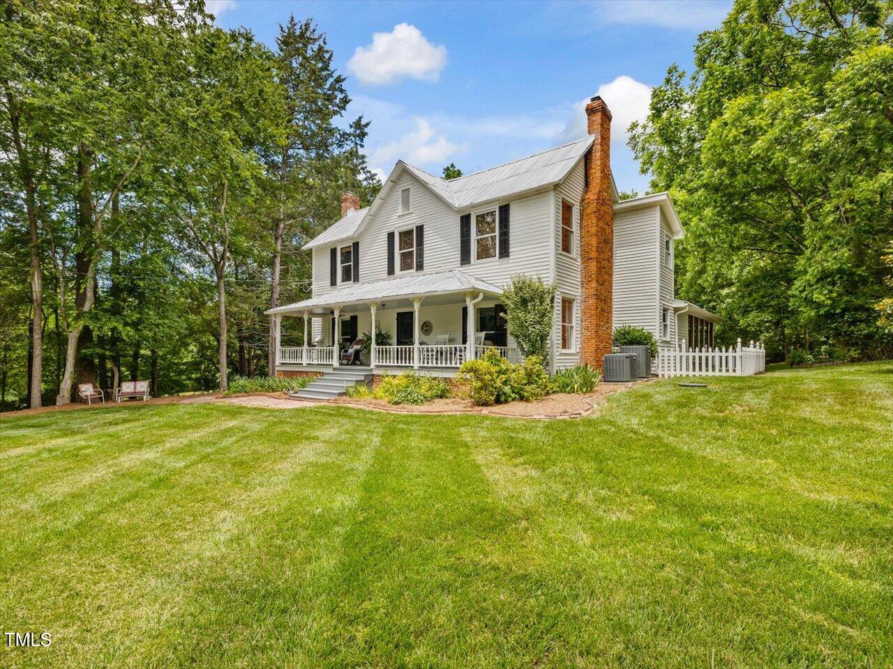 967 Bynum Road Pittsboro, NC 27312 - Photo 10 of 100 a front view of a house with a yard