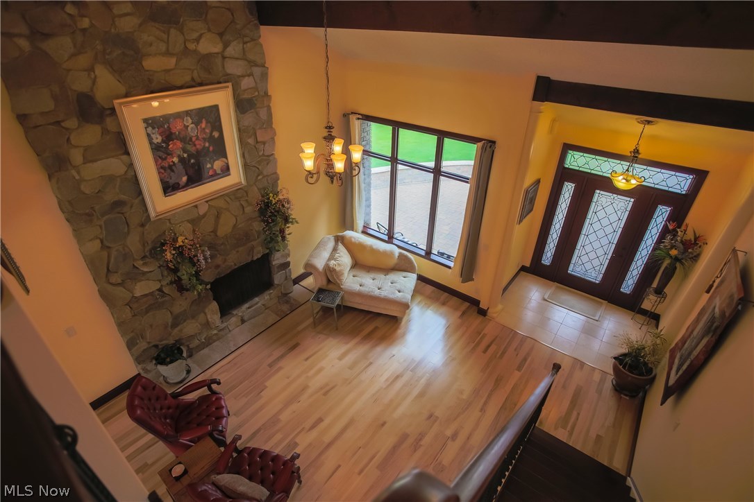 6290 Riverview Road Peninsula, OH 44264 - Photo 8 of 35 Great room & foyer view from staircase w/ wood beamed ceiling.