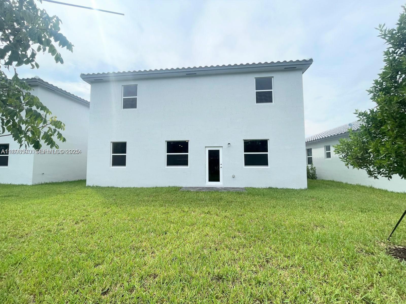 2647 Southeast 8th Street Homestead, FL 33030 - Photo 18 of 25 a house view with a backyard space