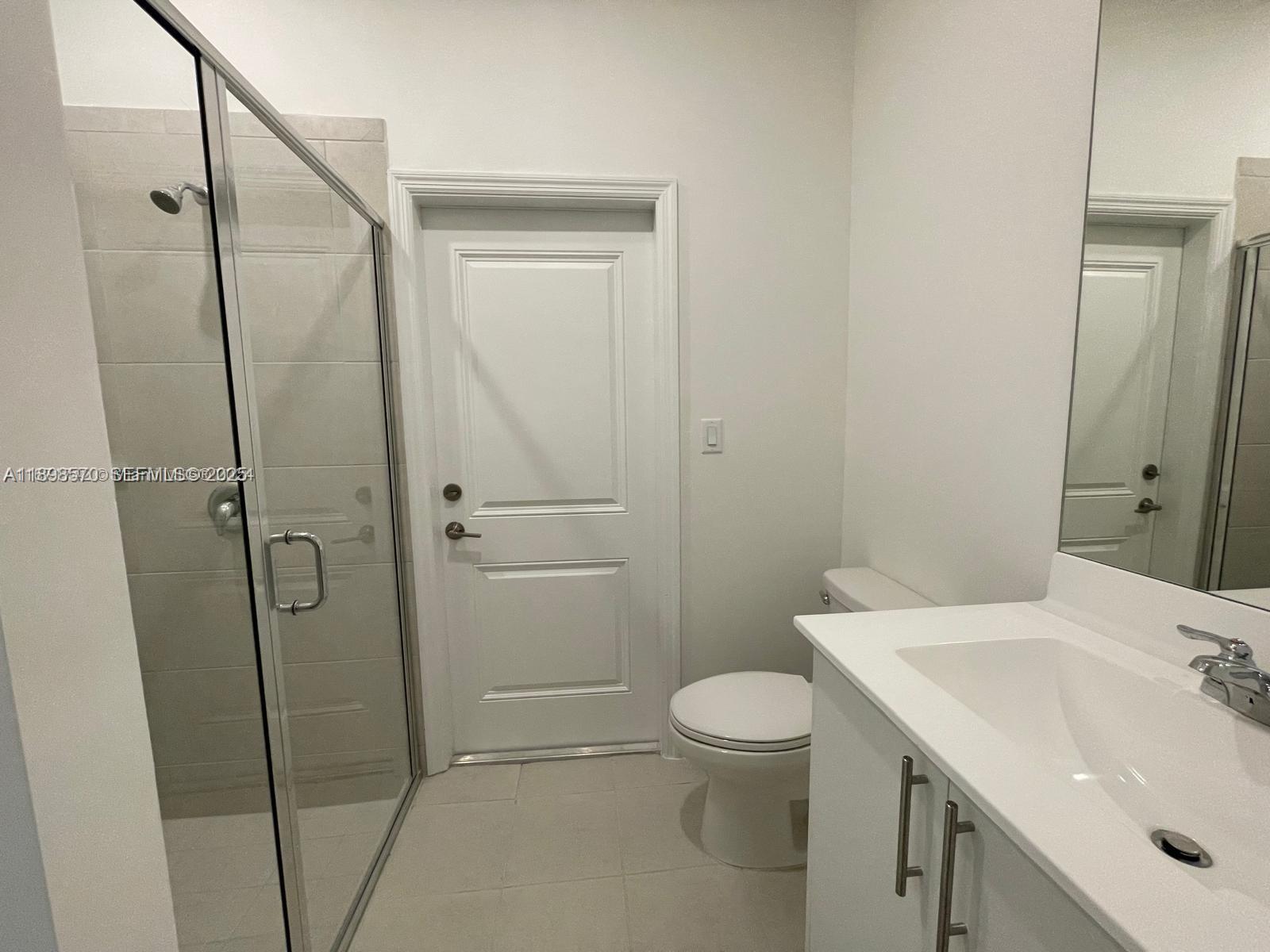 2647 Southeast 8th Street Homestead, FL 33030 - Photo 7 of 25 a bathroom with a sink a toilet and shower