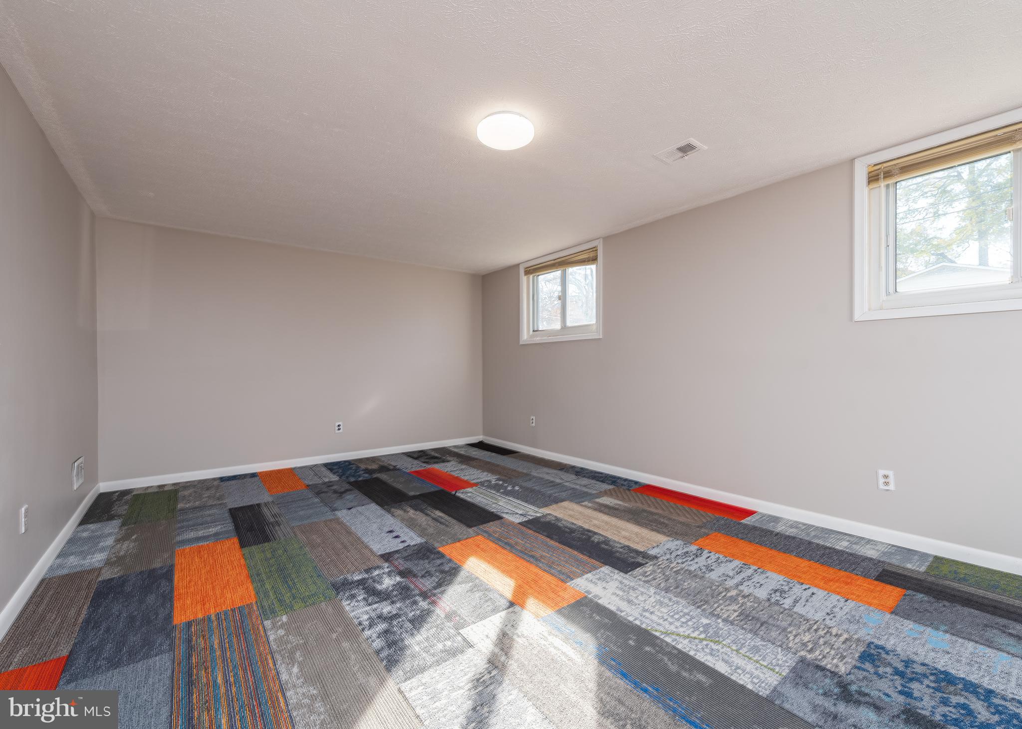 2006 Pelden Road Hyattsville, MD 20783 - Photo 16 of 22 Tile carpeting in lower level family room