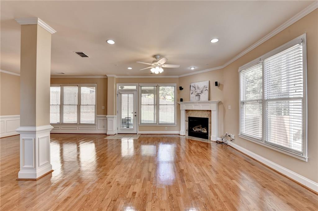 5063 Micaela Way Duluth, GA 30096 - Photo 10 of 61 a view of a livingroom with wooden floor and a fireplace