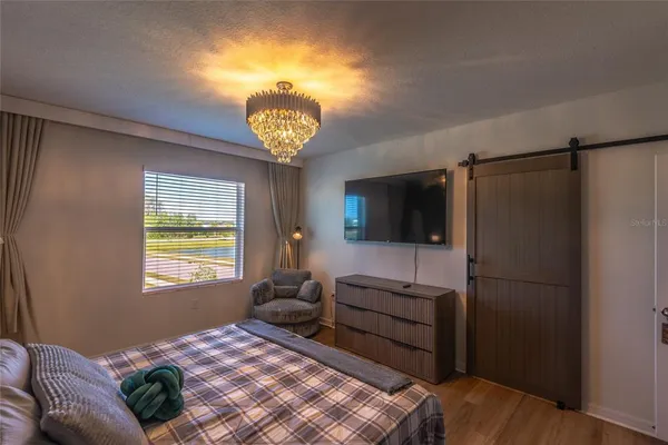 a bedroom with bed and a window