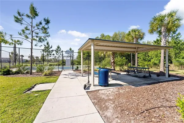 an aerial view of a house a yard and outdoor seating