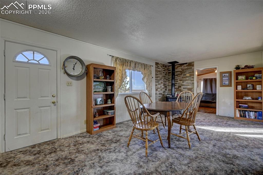 9420 Mulberry Road Calhan, CO 80808 - Photo 11 of 49 a view of a dining room with furniture and window