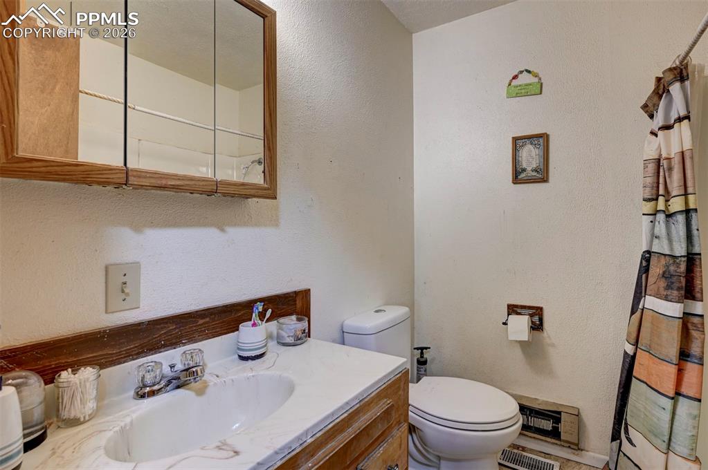 9420 Mulberry Road Calhan, CO 80808 - Photo 22 of 49 a bathroom with a sink and a toilet