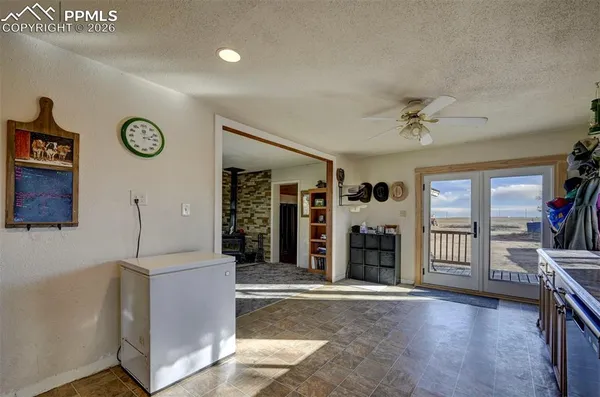 a view of an entryway with wooden floor