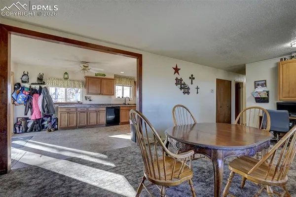 a dining room with furniture and entryway