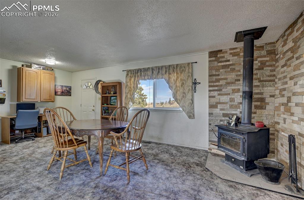 9420 Mulberry Road Calhan, CO 80808 - Photo 9 of 49 a view of a dining room with furniture