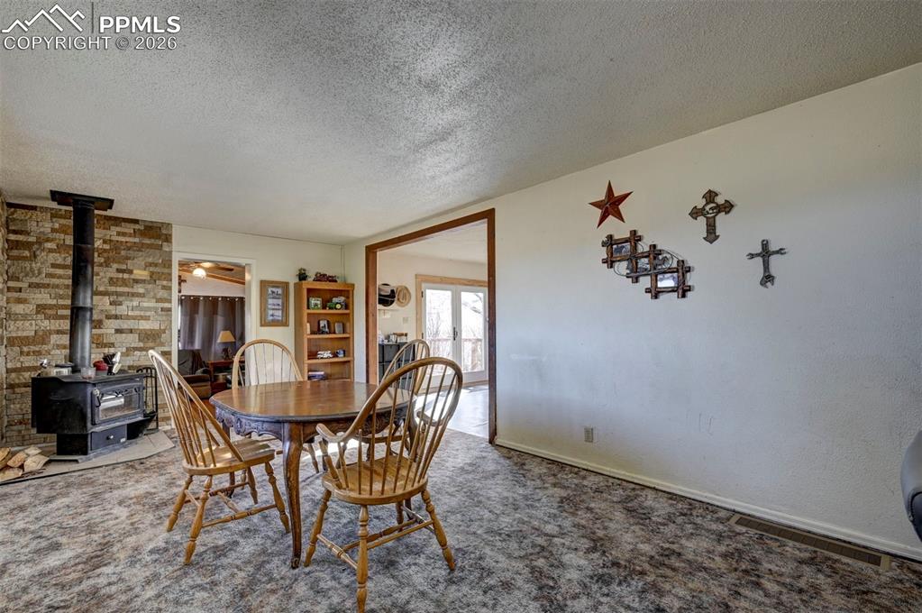 9420 Mulberry Road Calhan, CO 80808 - Photo 10 of 49 a dining room with furniture and window