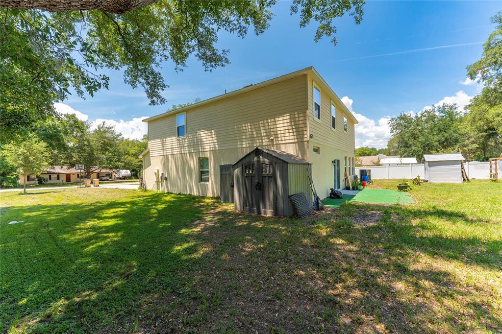 4331 Wayne Road Fruitland Park, FL 34731 - Photo 42 of 46 a view of a house with a yard
