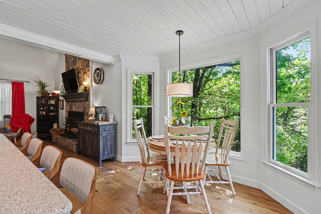 1136 Timber Ridge Lane Ellijay, GA 30540 - Photo 10 of 36 a view of a dining room with furniture window and outside view