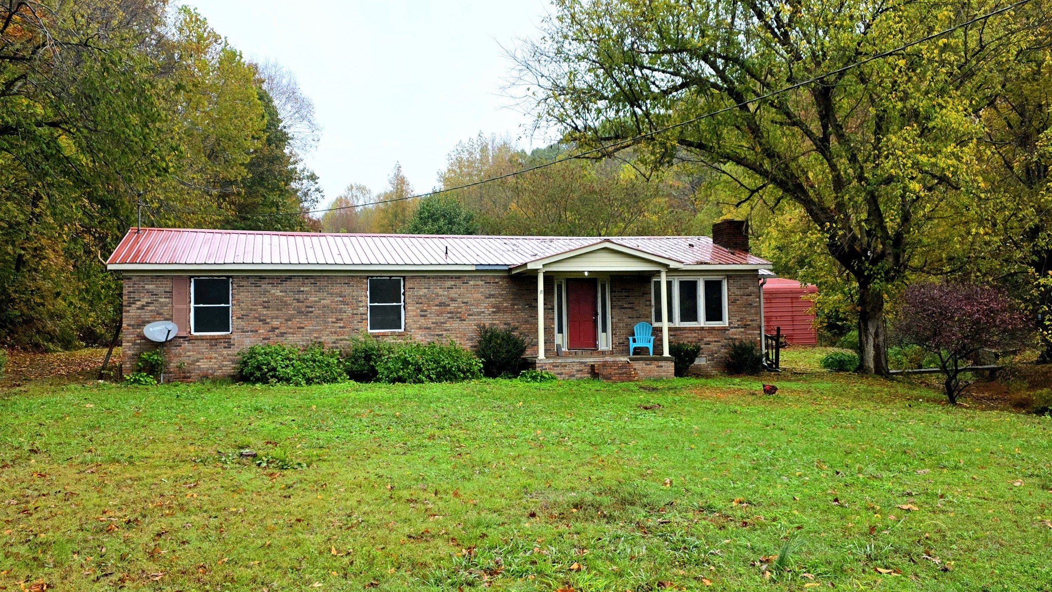 1570 Bear Creek Road Collinwood, TN 38450 - Photo 1 of 10 a front view of a house with garden