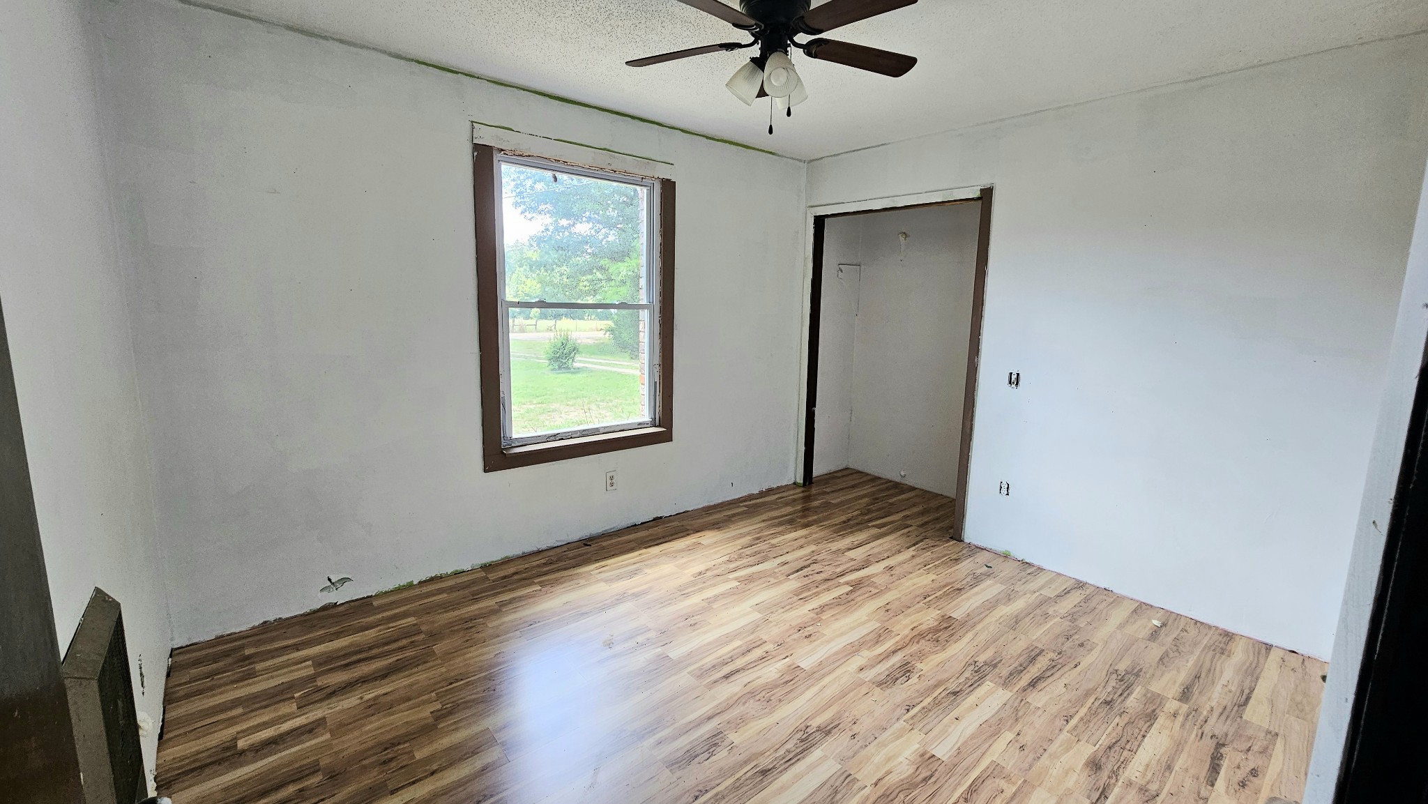 1570 Bear Creek Road Collinwood, TN 38450 - Photo 6 of 10 a view of empty room with wooden floor