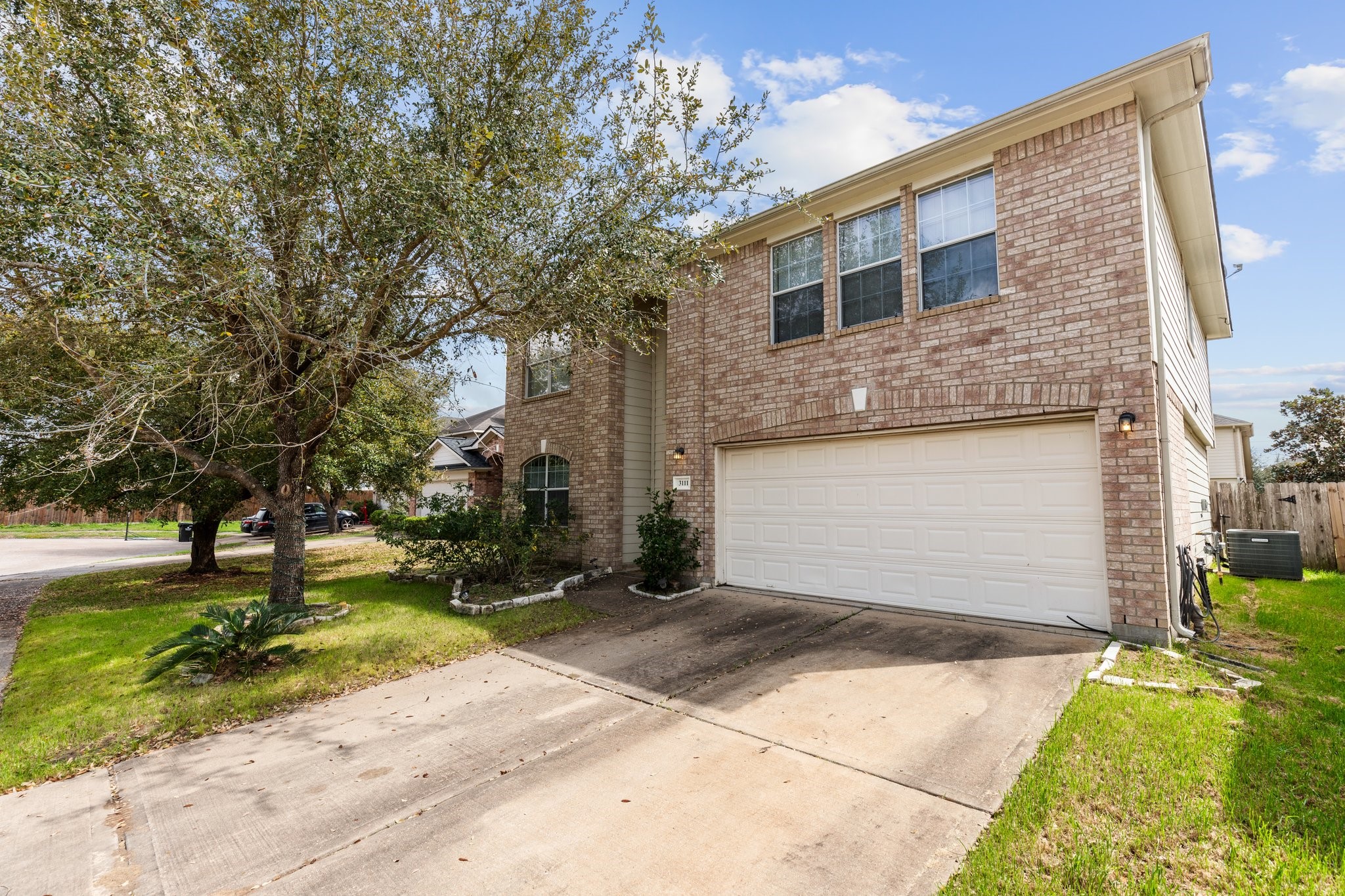 3111 Holly Ranch Drive Katy, TX 77494 - Photo 2 of 28 a front view of a house with a yard