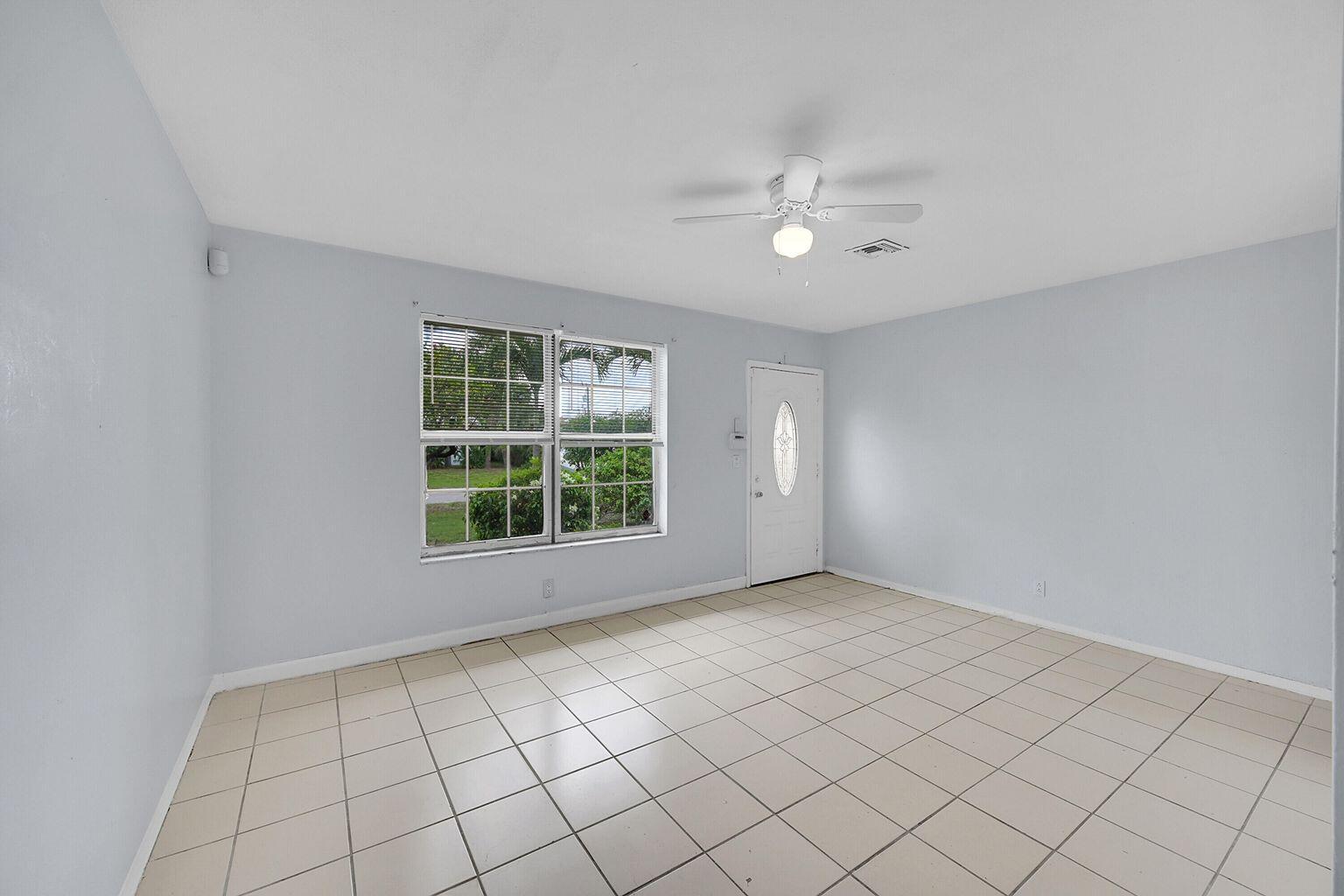 1645 West 31st Street Riviera Beach, FL 33404 - Photo 13 of 20 a view of an empty room with a window