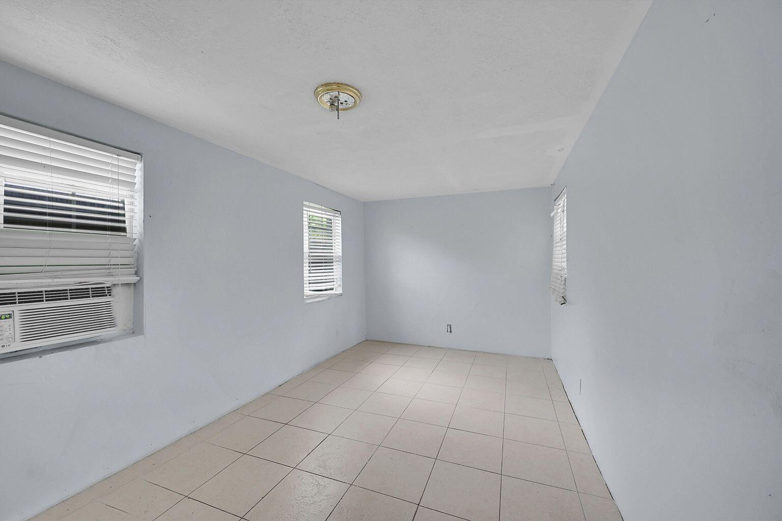 1645 West 31st Street Riviera Beach, FL 33404 - Photo 15 of 20 a view of an empty room with a window