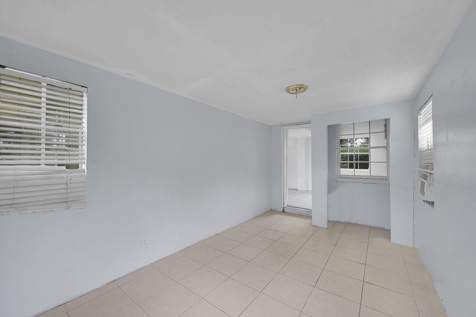 1645 West 31st Street Riviera Beach, FL 33404 - Photo 16 of 20 a view of an empty room with a window