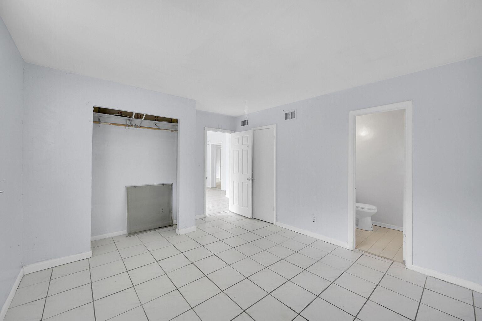 1645 West 31st Street Riviera Beach, FL 33404 - Photo 6 of 20 a view of an empty room