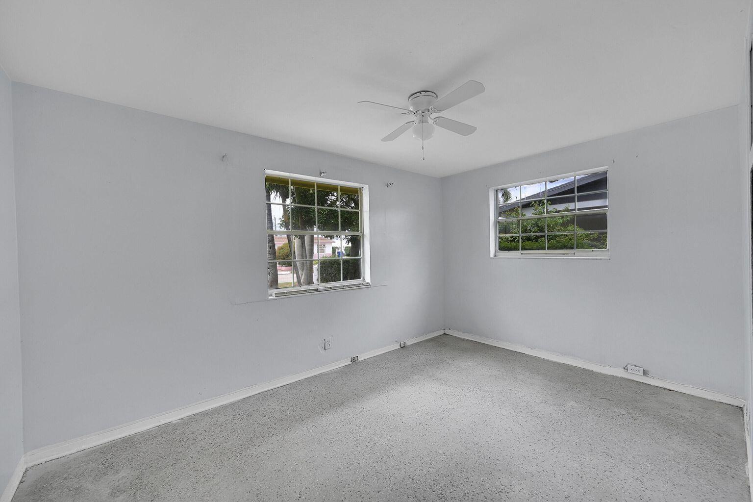 1645 West 31st Street Riviera Beach, FL 33404 - Photo 8 of 20 a view of an empty room with a window