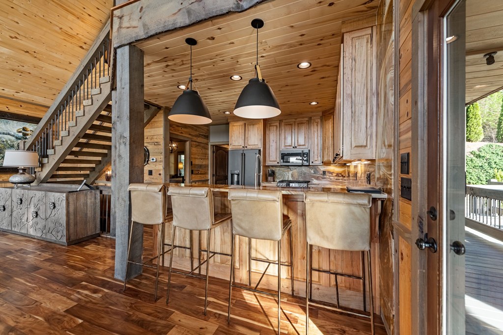 239 Covered Bridge Lane Cherry Log, GA 30522 - Photo 15 of 50 a view of kitchen with dining area and chandelier