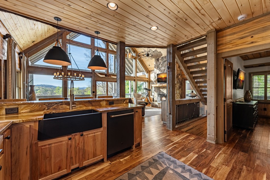 239 Covered Bridge Lane Cherry Log, GA 30522 - Photo 17 of 50 a kitchen with stainless steel appliances a sink stove and cabinets