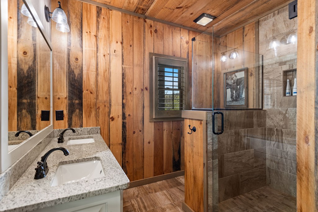 239 Covered Bridge Lane Cherry Log, GA 30522 - Photo 25 of 50 a bathroom with mirror sink and shower