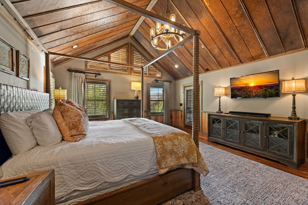 239 Covered Bridge Lane Cherry Log, GA 30522 - Photo 28 of 50 a bedroom with a bed and a flat tv screen on dresser