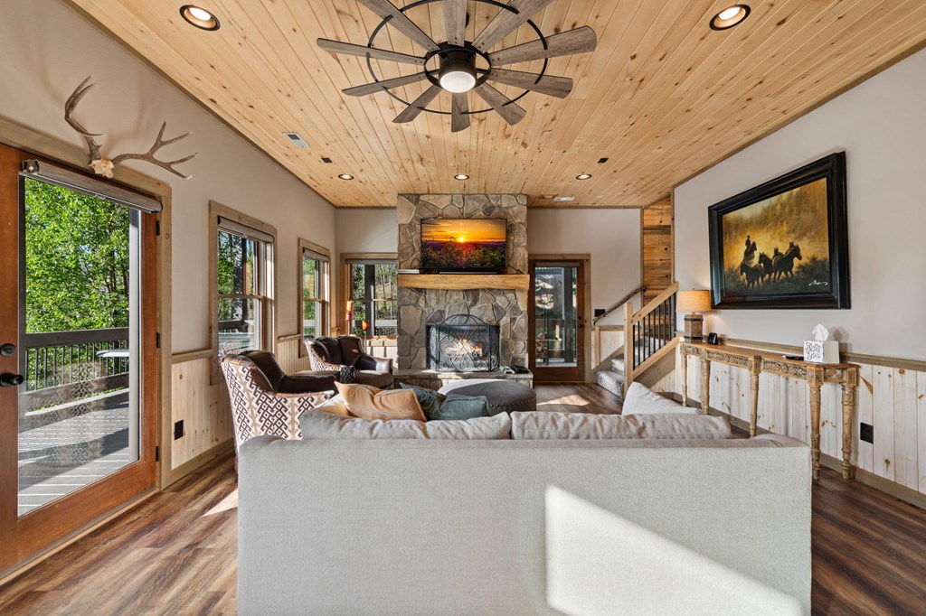 239 Covered Bridge Lane Cherry Log, GA 30522 - Photo 32 of 50 a living room with fireplace furniture and a flat screen tv
