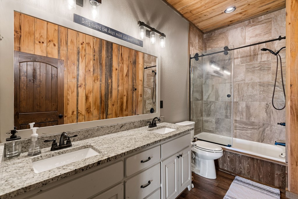 239 Covered Bridge Lane Cherry Log, GA 30522 - Photo 38 of 50 a bathroom with a granite countertop sink toilet and shower