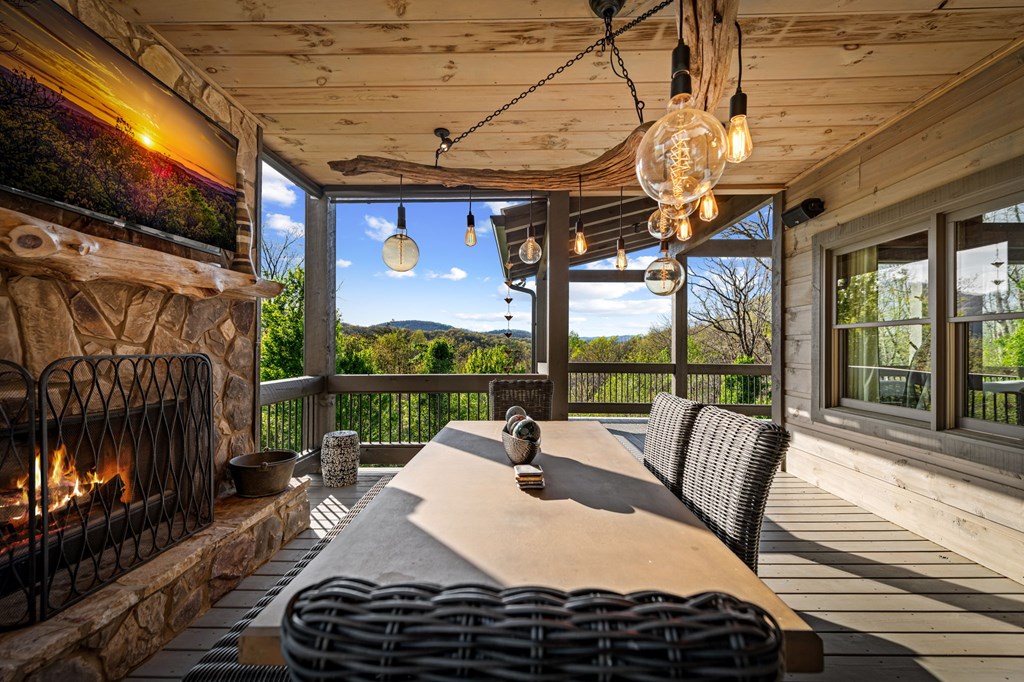 239 Covered Bridge Lane Cherry Log, GA 30522 - Photo 46 of 50 a view of a patio with a dining table and chairs