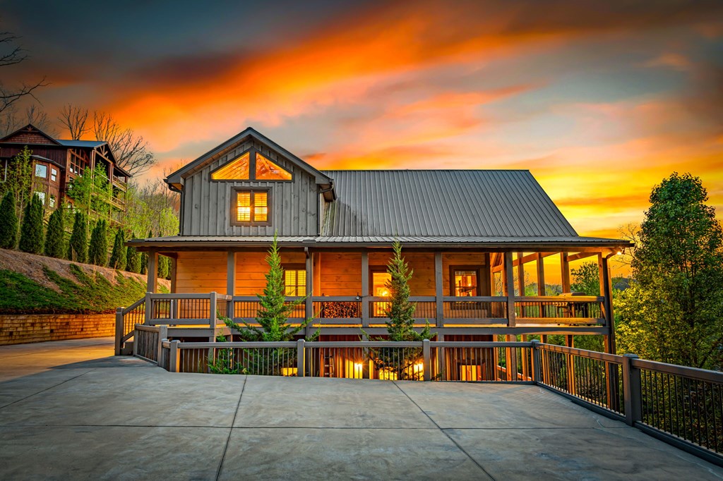 239 Covered Bridge Lane Cherry Log, GA 30522 - Photo 6 of 50 a view of a house with large windows and a small yard