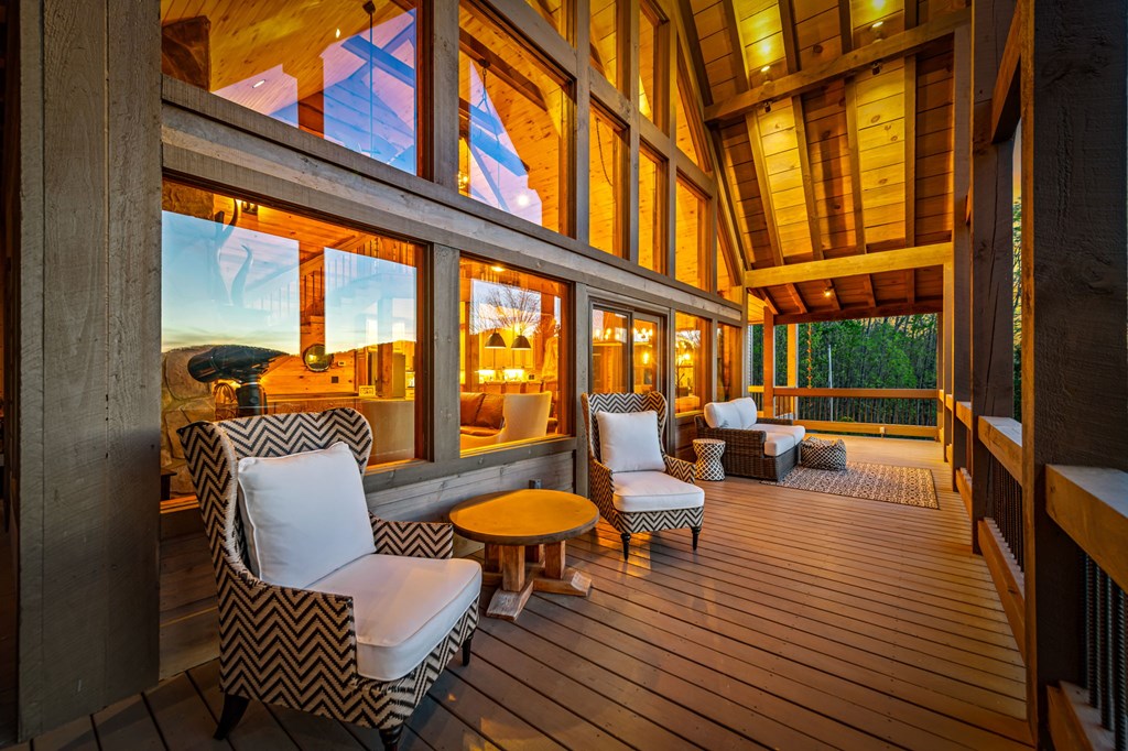 239 Covered Bridge Lane Cherry Log, GA 30522 - Photo 7 of 50 a living room filled with furniture and a floor to ceiling window