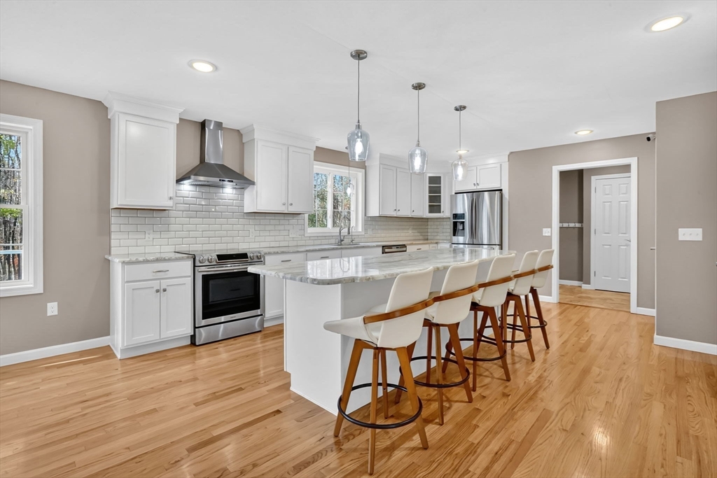 733 Monson Road Wilbraham, MA 01095 - Photo 12 of 40 a large kitchen with kitchen island a large island in the center