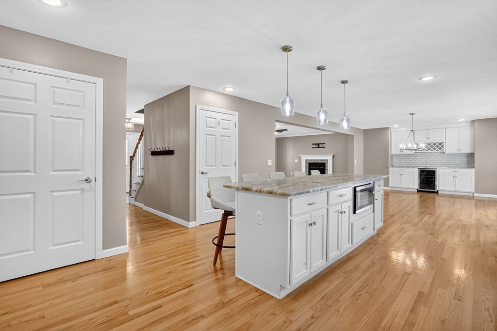 733 Monson Road Wilbraham, MA 01095 - Photo 14 of 40 a kitchen with stainless steel appliances granite countertop a white refrigerator a stove a sink and a wooden floors