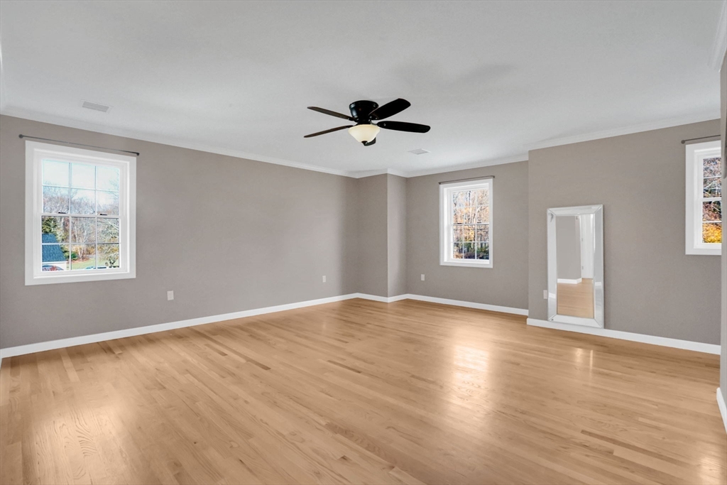 733 Monson Road Wilbraham, MA 01095 - Photo 18 of 40 a view of an empty room with window and wooden floor