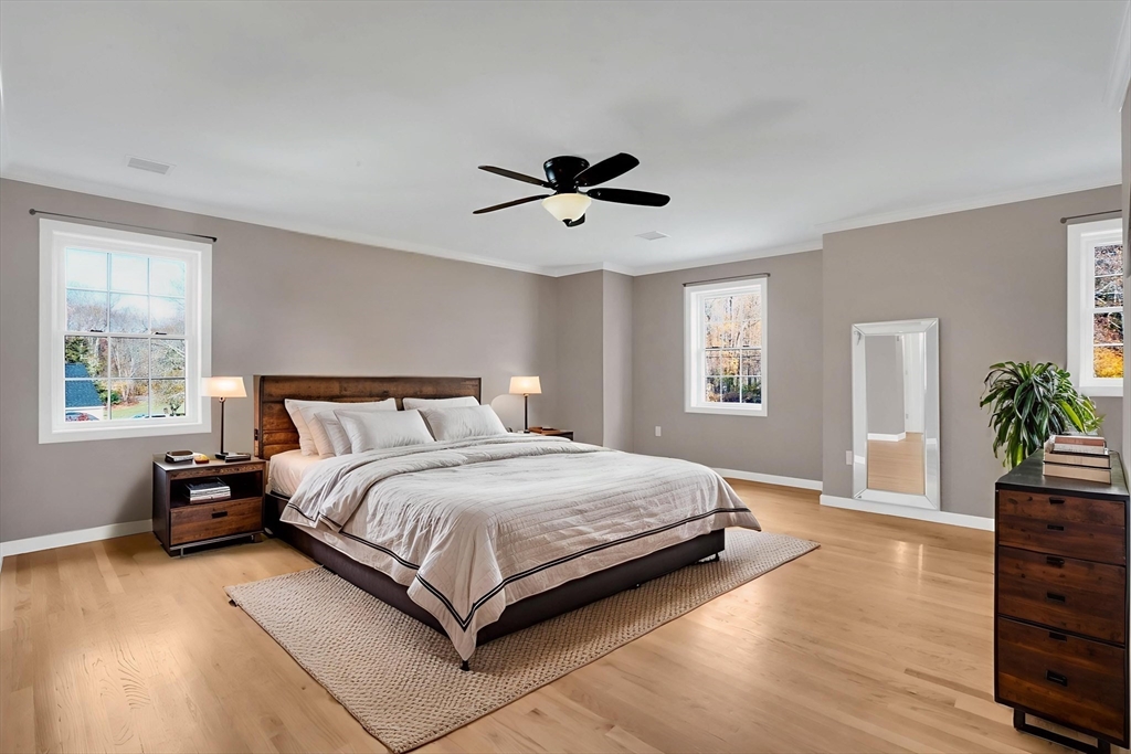 733 Monson Road Wilbraham, MA 01095 - Photo 19 of 40 a bedroom with a bed chandelier and a window