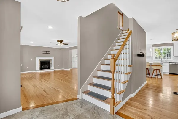 a view of entryway and hall with wooden floor