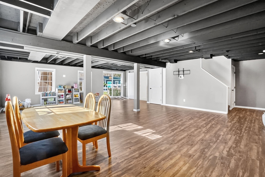 733 Monson Road Wilbraham, MA 01095 - Photo 31 of 40 a dining room with furniture a chandelier and wooden floor