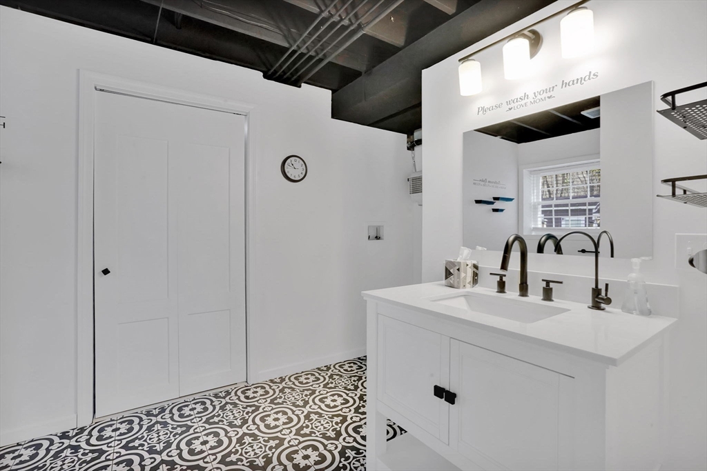 733 Monson Road Wilbraham, MA 01095 - Photo 33 of 40 a bathroom with a sink and a mirror