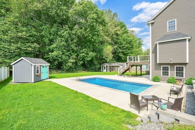 a house view with a sitting space and garden