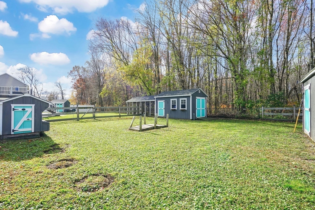733 Monson Road Wilbraham, MA 01095 - Photo 38 of 40 a swimming pool with lots of tress in front of it
